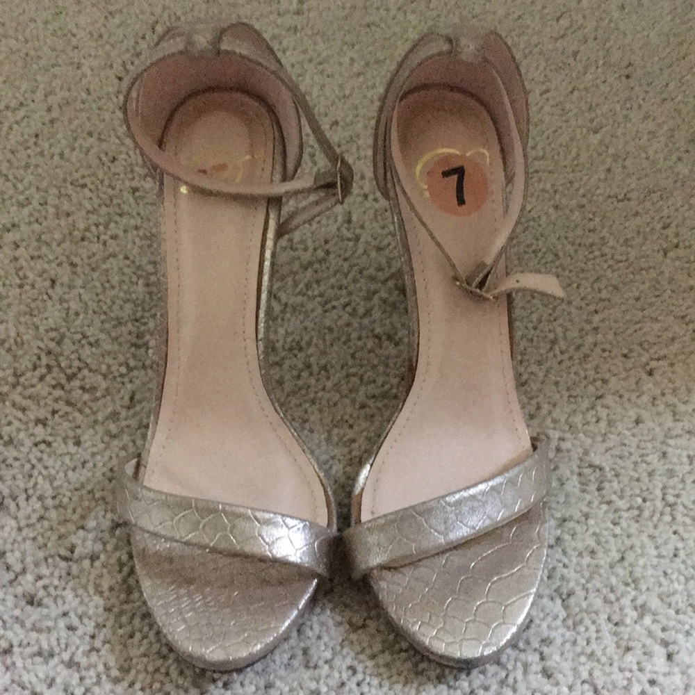 Gold open toe heels with ankle strap. Size 7.